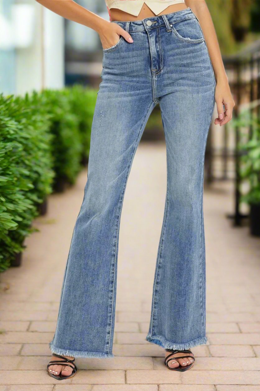 Untamed Raw Hem High Rise Flare Jeans in Medium Wash