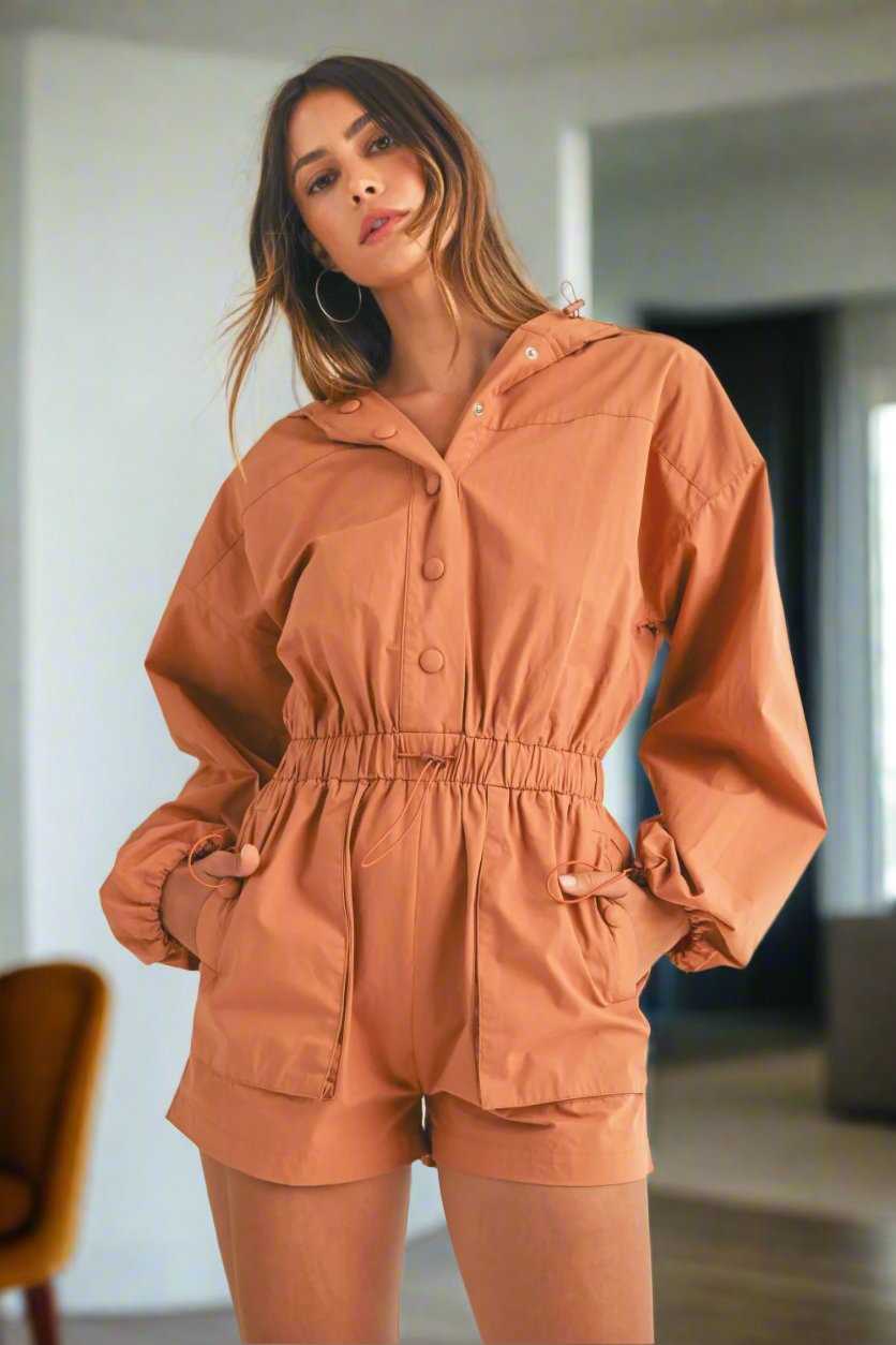 In a Snap Button Hooded Romper in Tan