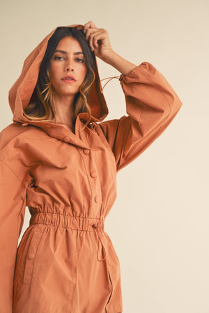 In a Snap Button Hooded Romper in Tan